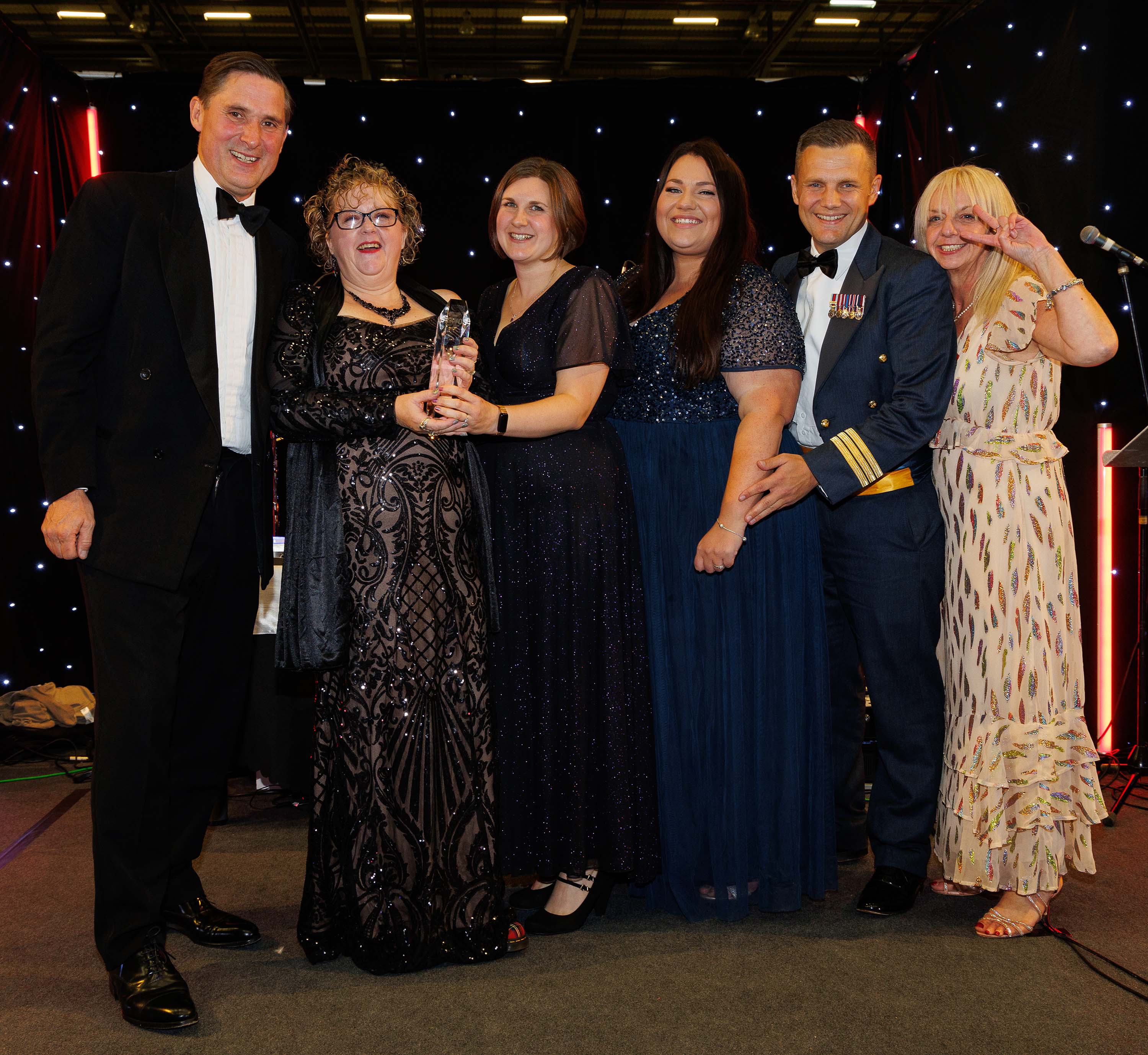 Photo: The Best Business Award went to Carterton Family Centre. Image shows staff having received thir award from our local MP, Charlie Maynard!